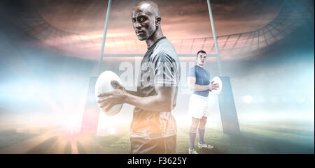 Zusammengesetztes Bild des Rugby-Spieler mit Rugby-ball Stockfoto