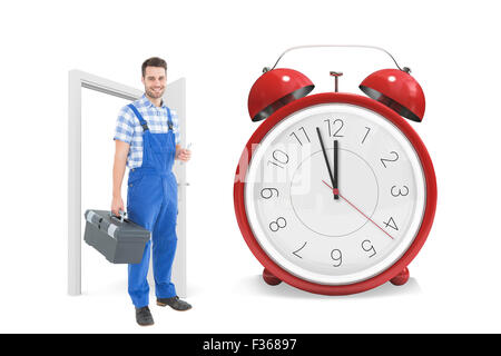 Zusammengesetztes Bild des männlichen Handwerker tragen toolbox Stockfoto