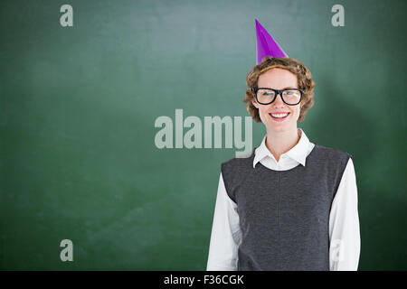 Zusammengesetztes Bild geeky Hipster einen Party Hut Stockfoto