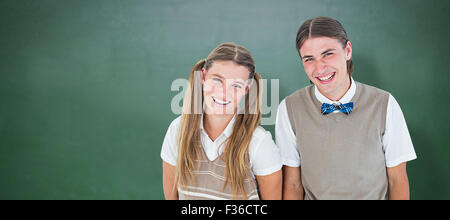 Zusammengesetztes Bild des Lächelns geeky Hipster Blick in die Kamera Stockfoto