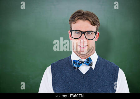 Zusammengesetztes Bild geeky Hipster Blick in die Kamera Stockfoto