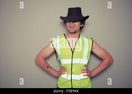 Eine freche Cowboy-Generator ist eine Warnweste tragen. Stockfoto