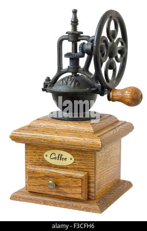 Die mechanische Kaffeemühle ist eine Retro aus Gusseisen und einer Eiche gefertigt. Massenproduktion. Isoliert Stockfoto