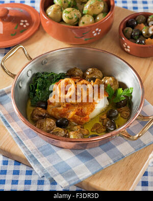 Bacalhau À Lagareiro. Kabeljau in Olivenöl. Portugal-Essen Stockfoto