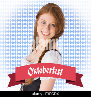 Zusammengesetztes Bild des Oktoberfest Mädchen lächelnd in die Kamera Stockfoto