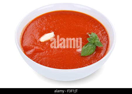 Tomaten Suppe essen in Schüssel mit Tomaten auf einem weißen Hintergrund isoliert Stockfoto