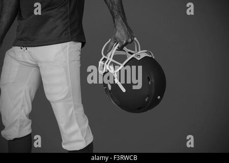 Zusammengesetztes Bild des Mittelteils des Spieler, Rugby-Helm Stockfoto