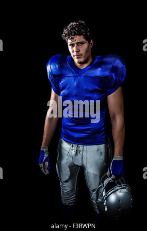 Zusammengesetztes Bild des Porträts von zuversichtlich, US-amerikanischer american-Footballspieler mit Helm Stockfoto