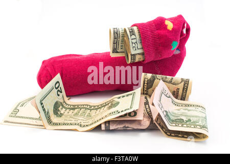 Geld in einer Socke, isoliert auf weiss. Stockfoto