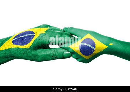 Zwei Hände und brasilianische Flagge Stockfoto