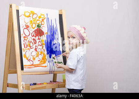 Mädchen-Künstler-Farben auf Leinwand Stockfoto