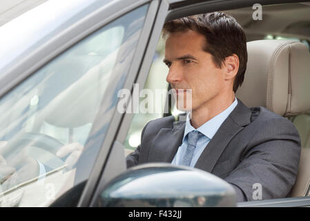 Geschäftsmann Steuerwagen Stockfoto