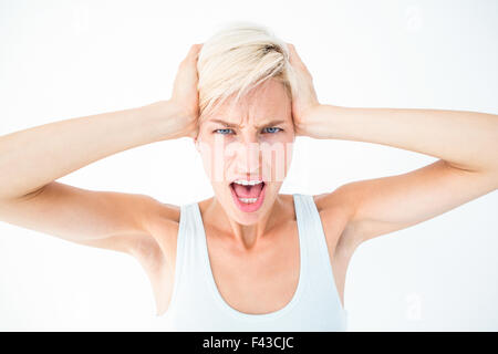 Böse Frau schreien und hielt ihren Kopf Stockfoto