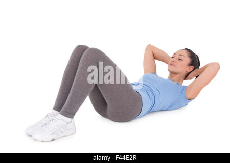 Brünette macht fit Sit-Ups Stockfoto