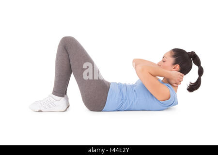 Brünette macht fit Sit-Ups Stockfoto