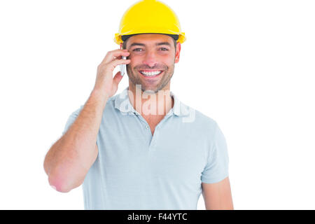 Lächelnde Handwerker telefonieren mit Handy Stockfoto