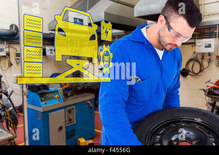 Zusammengesetztes Bild von mechanischen Arbeiten auf Reifen Stockfoto