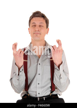 Mann Kreuzung Finger Stockfoto