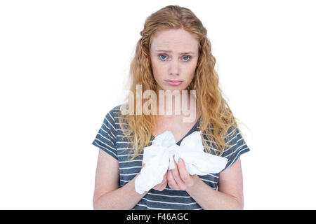 Krank blonde Frau mit Papiertuch Stockfoto