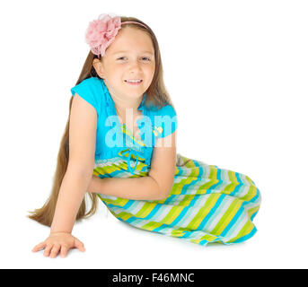 Kleines Mädchen im blauen Kleid isoliert Stockfoto