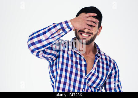 Porträt von verärgert Manndeckung seine Augen auf einem weißen Hintergrund isoliert Stockfoto