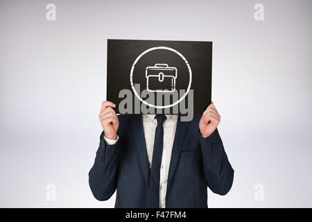 Zusammengesetztes Bild des Kaufmanns holding board Stockfoto