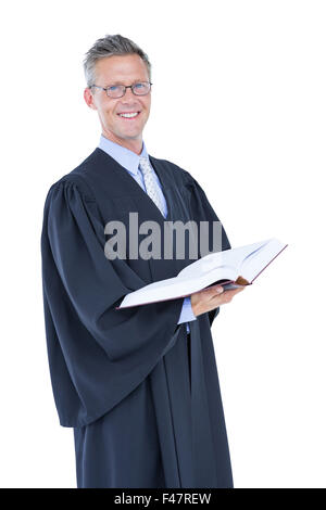 Glücklich schönen Anwalt hält Arbeitsgesetzbuch Stockfoto