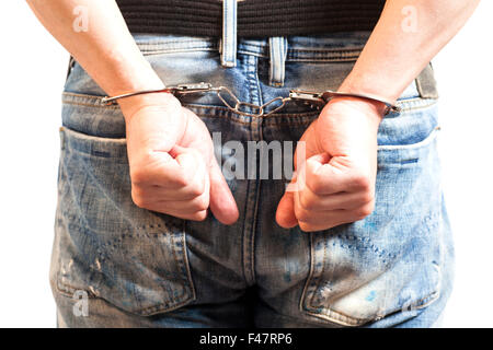 Nahaufnahme von Mann in Handschellen verhaftet isoliert auf weiss Stockfoto