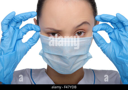 Junger Arzt trug eine Maske und Handschuhe Stockfoto