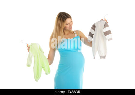 Schwangere, Baby-Kleidung kaufen Stockfoto