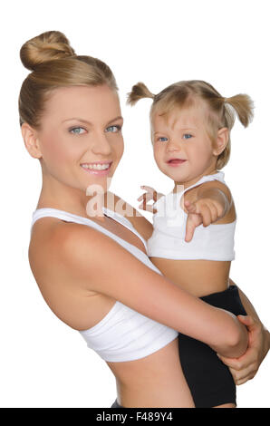 Mutter mit ihrer Tochter in Yoga Kleidung Stockfoto