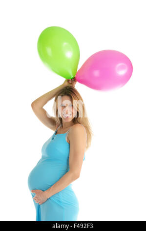 Schwangere Frau mit bunten Luftballons Stockfoto