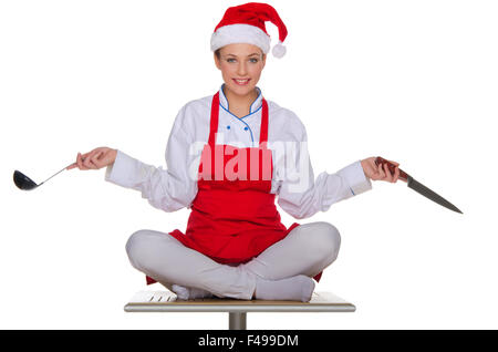 Kochen Sie mit Gerichten in der Kappe von Santa Claus Stockfoto