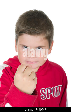 Kleiner Junge droht mit der Faust Stockfoto