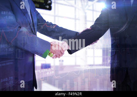 Composite image of handshake in agreement Stockfoto