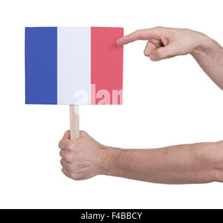 Hand, die kleine Karte, isoliert auf weiss - Flagge von Frankreich Stockfoto