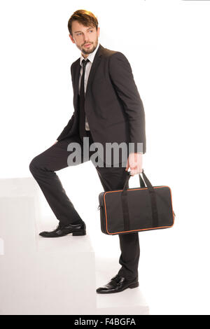 Geschäftsmann, Treppensteigen mit einer Aktentasche Stockfoto