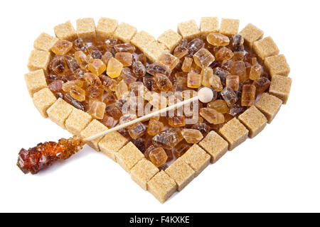 Herzen von nicht raffinierten Reed Zucker und Süßigkeiten auf einem stick Stockfoto