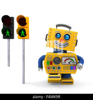Gelbe Spielzeugroboter glücklich an grüne Ampel Stockfoto