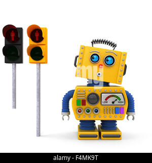 Gelbe Spielzeugroboter an einer roten Ampel warten Stockfoto