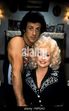 Sylvester Stallone und Dolly Parton / Strass / 1984 unter der Regie von Bob Clark Stockfoto