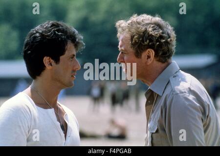 Sylvester Stallone und Michael Caine / Escape to Victory / 1981 unter der Regie von John Huston Stockfoto