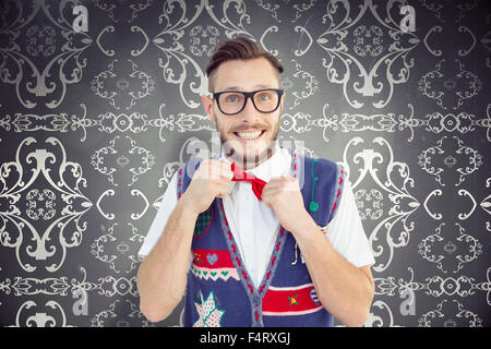 Zusammengesetztes Bild geeky Hipster mit Weihnachten Weste Stockfoto