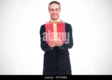 Zusammengesetztes Bild des lächelnden Geschäftsmann streckte seine Hände Stockfoto