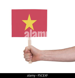 Hand, die kleine Karte, isoliert auf weiss - Flagge Vietnam Stockfoto