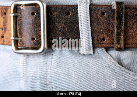Alte Vintage Leder Gürtel Jeans closeup Stockfoto