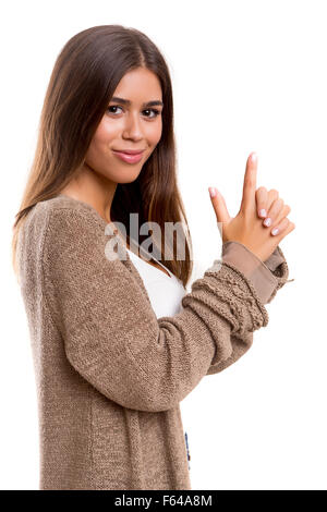 Junge Frau macht eine Waffe mit ihren Händen - Business-Konzept Stockfoto