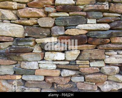 Steinmauer Muster aus alten Blockhütte Kamin Stockfoto