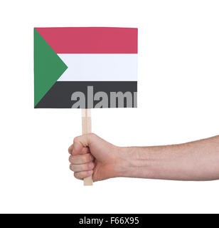 Hand, die kleine Karte, isoliert auf weiss - Flagge des Sudan Stockfoto