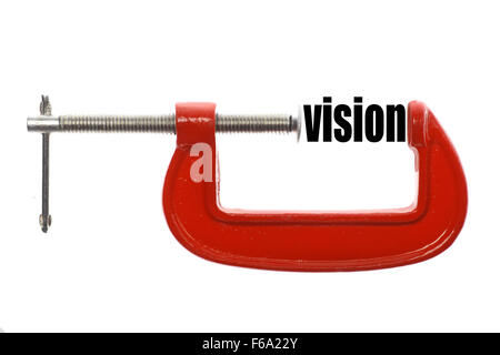 Das Wort "Vision" ist mit einem Schraubstock komprimiert. Stockfoto